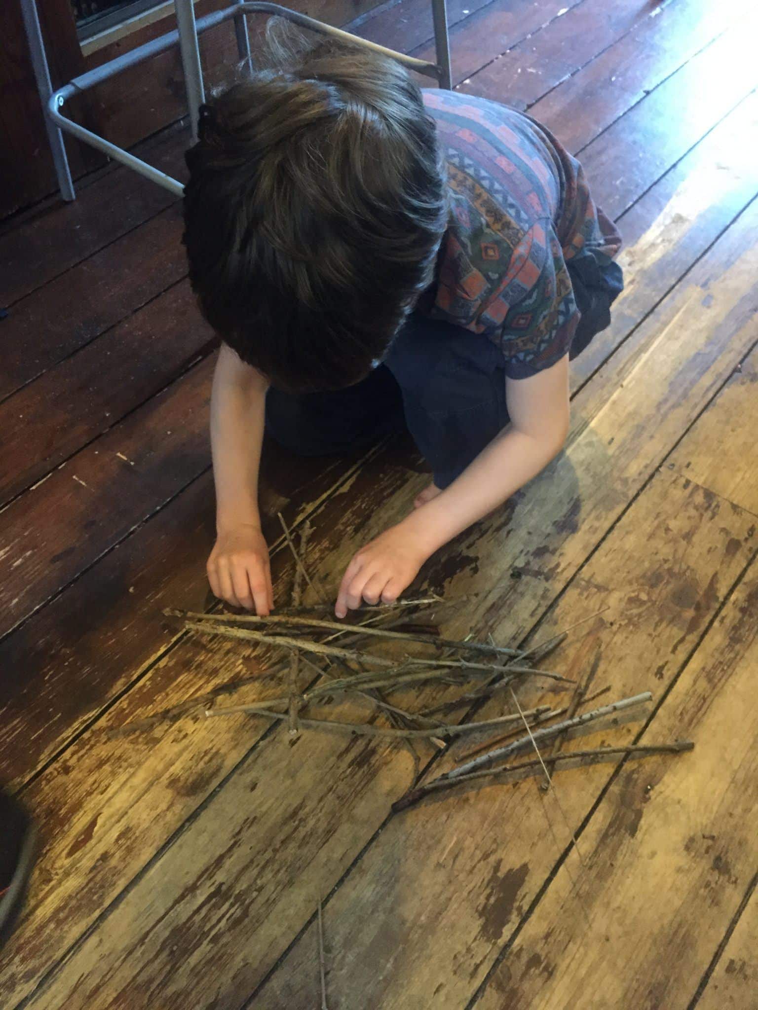 Child playing pick up sticks Get Out More
