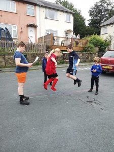 Get Out More Street Support Session with Keighley Children playing traditional skipping games